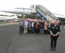 Brooklands Motor and Aero Museum in Surrey - Donna Hopton of Brooklands with a group of tour buyers from around the UK